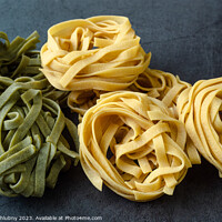 Buy canvas prints of Fresh homemade green and yellow pasta tagliatelle. Raw homemade  by Lubos Chlubny