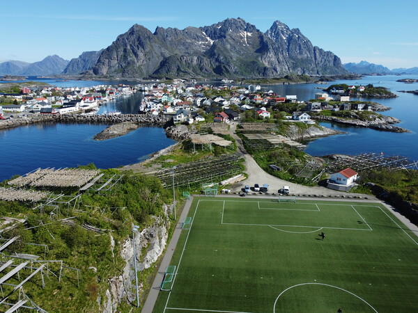 Aerial view of fishing village and football field on Lofoten Islands in Norway Picture Board by Irena Chlubna