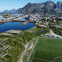 Buy canvas prints of Aerial view of fishing village and football field on Lofoten Islands in Norway by Irena Chlubna