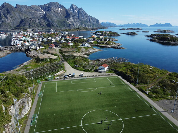 Aerial view of fishing village and football field on Lofoten Islands in Norway Picture Board by Irena Chlubna