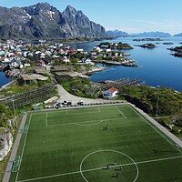 Buy canvas prints of Aerial view of fishing village and football field on Lofoten Islands in Norway by Irena Chlubna