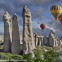 Buy canvas prints of Fairy Chimneys and Hot Air Balloons in Cappadocia by Paul E Williams