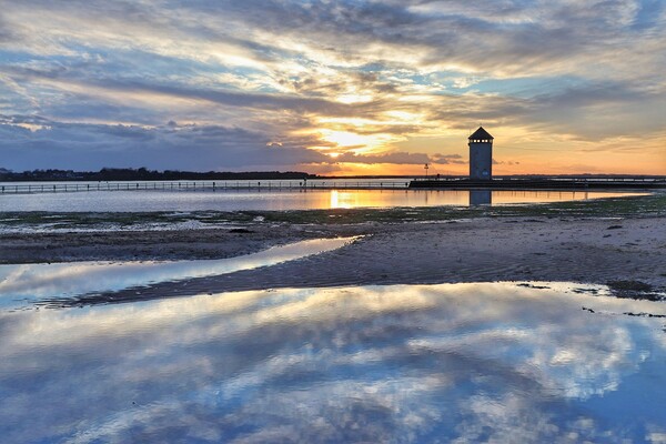 Sunset over Batemans tower in Brightlingsea essex  Picture Board by Tony lopez