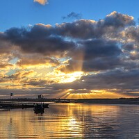 Buy canvas prints of Sunrise rays and cloudscspe over Brightlingsea Creek  by Tony lopez