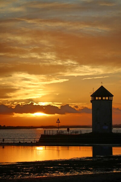 Sunset over the Batemans Tower in Brightlingsea essex at sunset  Picture Board by Tony lopez