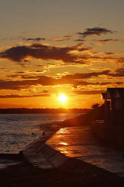 Sunset over Brightlingsea Beach  Picture Board by Tony lopez