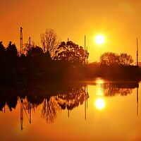 Buy canvas prints of Sunrise reflections over St Osyth Boatyard in essex  by Tony lopez