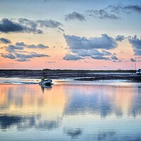 Buy canvas prints of To work over the Brightlingsea Harbour in colourful reflections  by Tony lopez