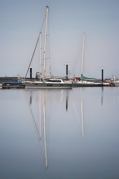 Morning calm over Brightlingsea Harbour with great reflections  Picture Board by Tony lopez