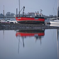 Buy canvas prints of Low tide over Brightlingsea Harbour in reflection  by Tony lopez