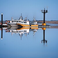 Buy canvas prints of Morning blue reflections over Brightlingsea Harbour  by Tony lopez