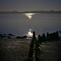 Buy canvas prints of Moon  down over Brightlingsea Creek  by Tony lopez