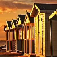 Buy canvas prints of Beach hut sunset reflections over Brightlingsea  by Tony lopez