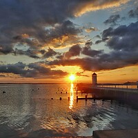 Buy canvas prints of Sunset colours over Batemans Tower in Brightlingsea  by Tony lopez