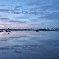 Buy canvas prints of Pre sunrise cloud and reflections over the Brightlingsea Harbour  by Tony lopez
