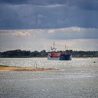 Buy canvas prints of Arriving at Brightlingsea Harbour in the afternoon sun   by Tony lopez