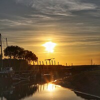 Buy canvas prints of Sunset colours over Blakeney Quay in reflection  by Tony lopez