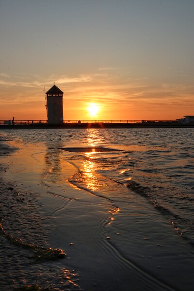 Sunsetting over the tidal pool in Brightlingsea  Picture Board by Tony lopez