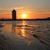 Buy canvas prints of Sunsetting over the tidal pool in Brightlingsea  by Tony lopez