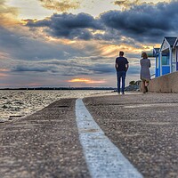 Buy canvas prints of Walking into the  sunset colours across the river Colne In  Brightlingsea.  by Tony lopez
