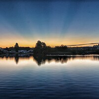 Buy canvas prints of Sun  rising over the Boating lake in Brightlingsea by Tony lopez