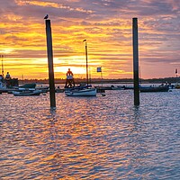 Buy canvas prints of Brightlingsea sunrise colours over the harbour  by Tony lopez