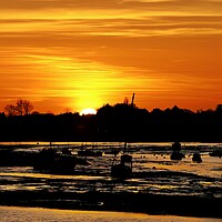 Buy canvas prints of Silhouettes sunrise over the Brightlingsea Harbour  by Tony lopez