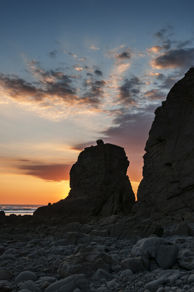 Sun Setting behind a Rock Stack Picture Board by Kevin Howchin