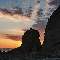 Buy canvas prints of Sun Setting behind a Rock Stack by Kevin Howchin