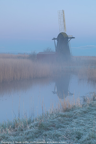 Herringfleet wind pump in the mist Picture Board by Derek Griffin