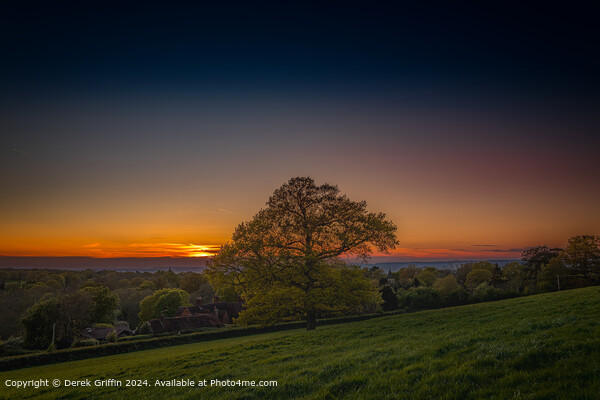The sun sets over the hamlet of Markbeech, Edenbridge, Kent Picture Board by Derek Griffin