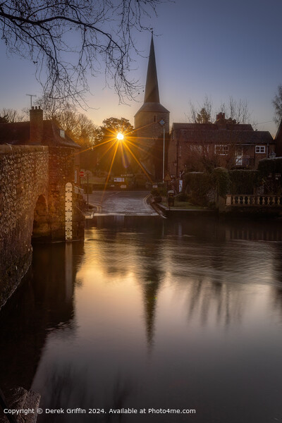 Th sunrises behind the church in Eynsford, Kent Picture Board by Derek Griffin