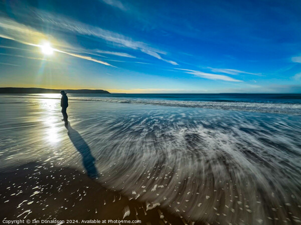 A Solo Walker on Woolacombe Beach. Picture Board by Ian Donaldson