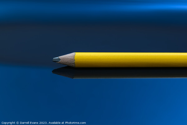 Yellow pencil on a blue background Picture Board by Darrell Evans