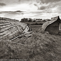 Buy canvas prints of Lindisfarne Boat Sheds by Darrell Evans