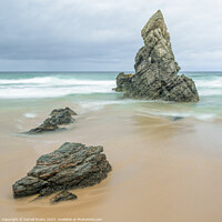 Buy canvas prints of Rocks on a golden beach by Darrell Evans