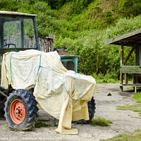 Buy canvas prints of Covered Tractor by Darrell Evans