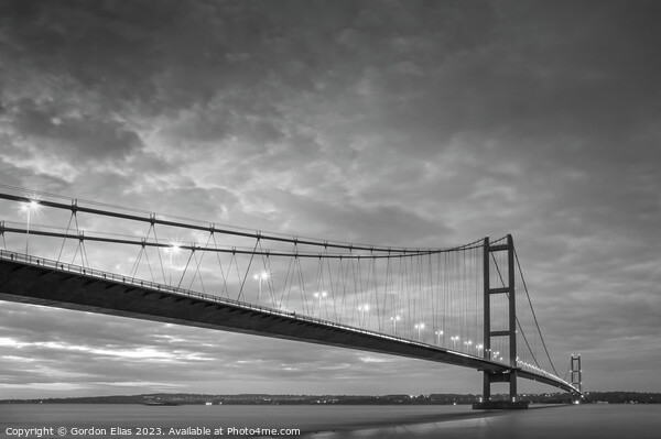 The Humber Bridge at Dusk - Monochrome  Picture Board by Gordon Elias