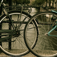 Buy canvas prints of Close up of two bicycle wheels by Alan Collins