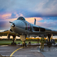 Buy canvas prints of Majestic Avro Vulcan Takes on the Stormy Skies by Andy Critchfield