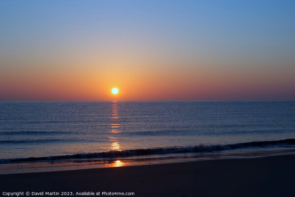 Sunrise over the sea Picture Board by David Martin
