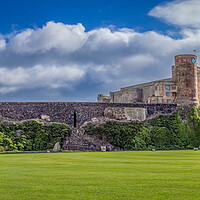 Buy canvas prints of Bamburgh Castle and Green by Paul Grubb