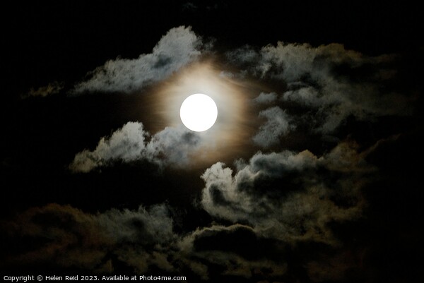 Dark super moon surrounded by clouds Picture Board by Helen Reid