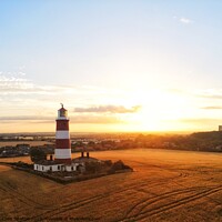 Buy canvas prints of Happisburgh Lighthouse at Sunset by Chris Spalton