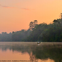 Buy canvas prints of Lake Sandoval at hazy sunset in the Peruvian Amazon by Madeleine Deaton