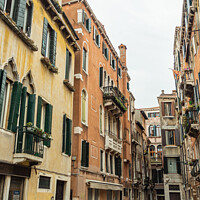 Buy canvas prints of Empty Pastel Colored Venetian Street During Winter by Madeleine Deaton