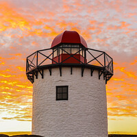 Buy canvas prints of Bury port lighthouse at sunset by Rick Pearce