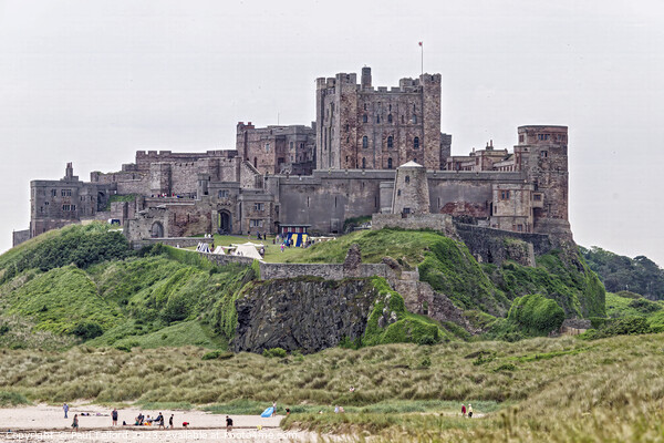 Bamburgh Castle: Beachside Historic Majesty Picture Board by Paul Telford