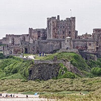Buy canvas prints of Bamburgh Castle: Beachside Historic Majesty by Paul Telford
