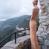 Buy canvas prints of red statue of woman watching  by Jonny Angle